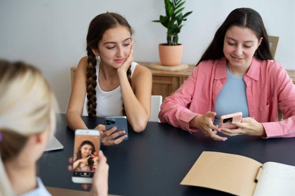 A group of Gen Z girls searching on their phones.